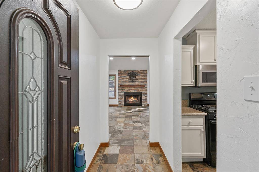 As you enter the home notice the fireplace straight ahead. Virtual Fire