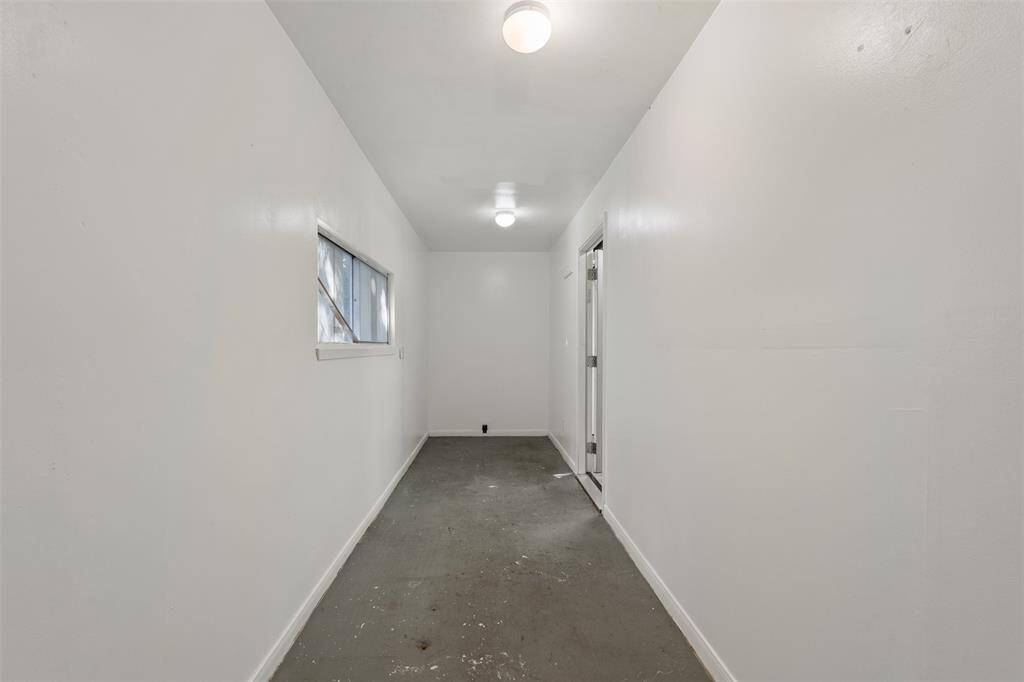 This is the room at the back of the garage,  measuring approximately 20.5 x 5.3' and has a window.  This would make an excellent storage area.