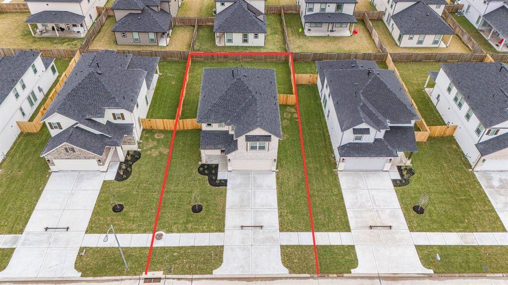 This home sits on a large lot with ample yard space in front and the back, lush landscaping and well-maintained yard!