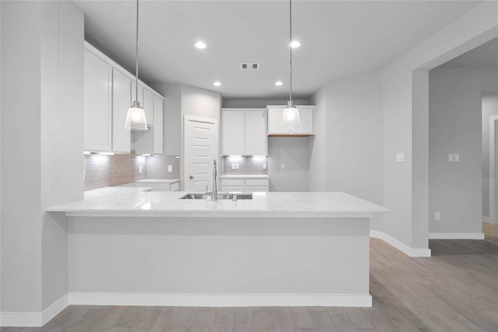 Any chef's dream, this stunning kitchen is perfect for everyday life as well as entertaining family and friends! Extra large counter space is perfect for conversation or that much needed space to lay out your party spread for everyone to enjoy!