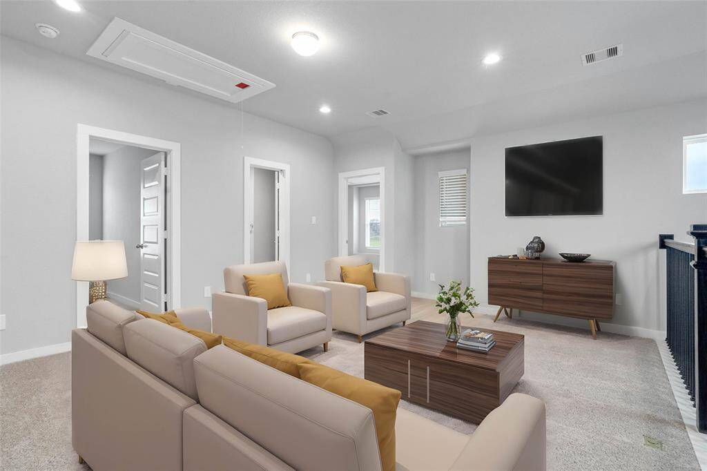 Come upstairs and enjoy a day of leisure in this fabulous game room! This is the perfect hangout spot or adult game room, this space features plush carpet, recessed lighting, and custom paint!