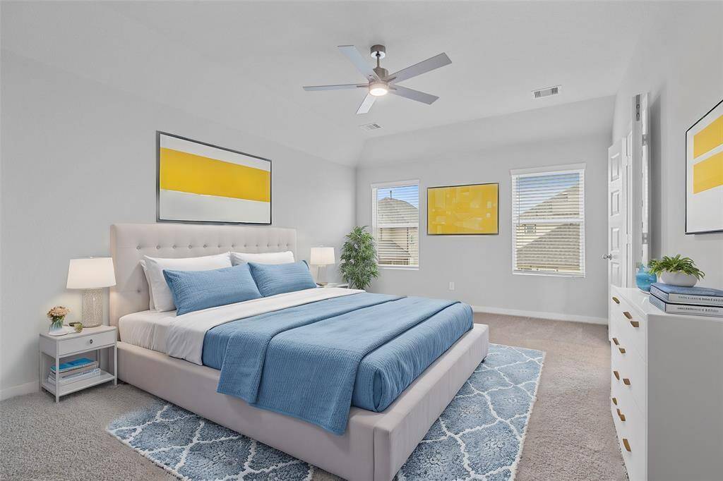 Come and unwind after a long day in this magnificent primary suite! This spacious room features plush carpet, warm paint, high ceilings with ceiling fan, and large windows with privacy blinds!