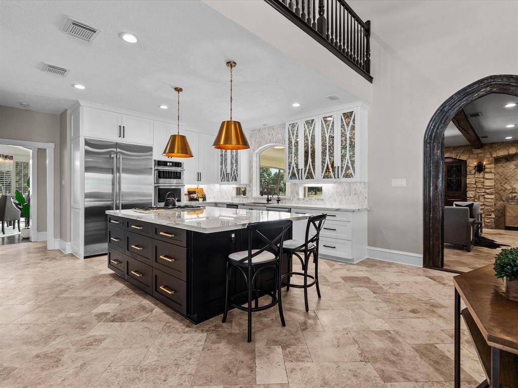 Designer kitchen featuring bespoke cabinetry.