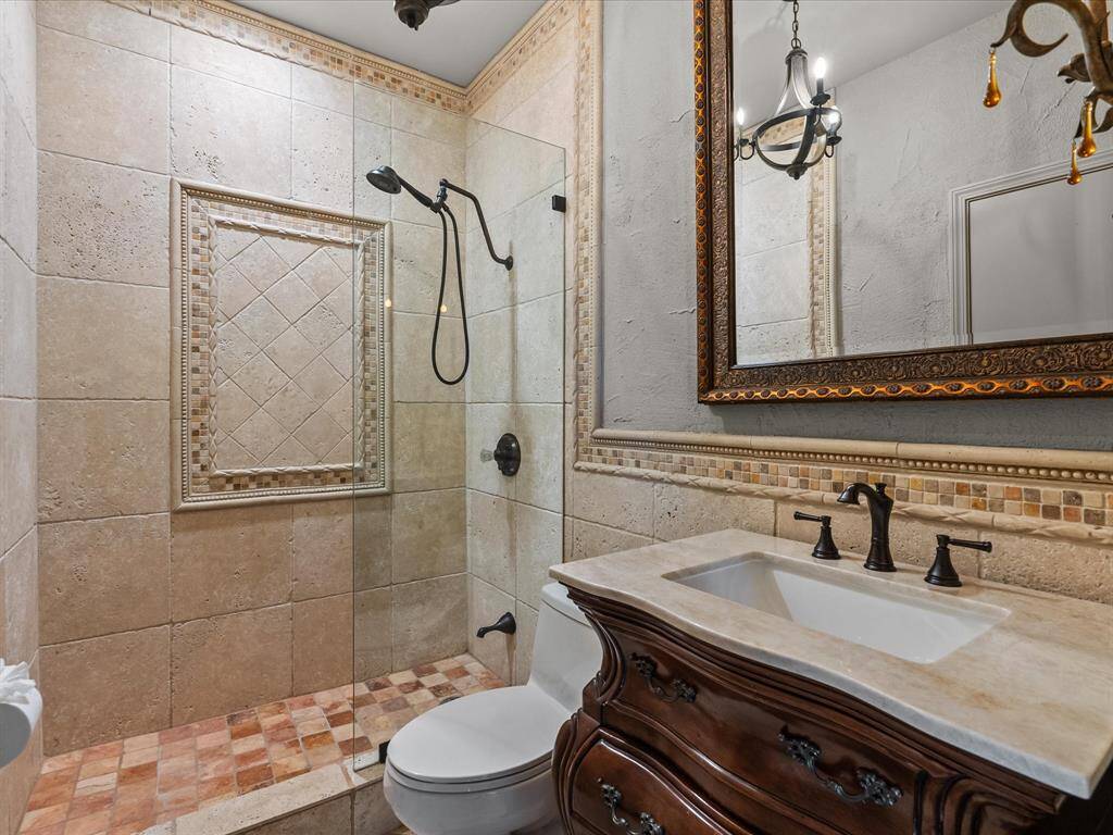 Ensuite wine room bathroom with elegant finishes.