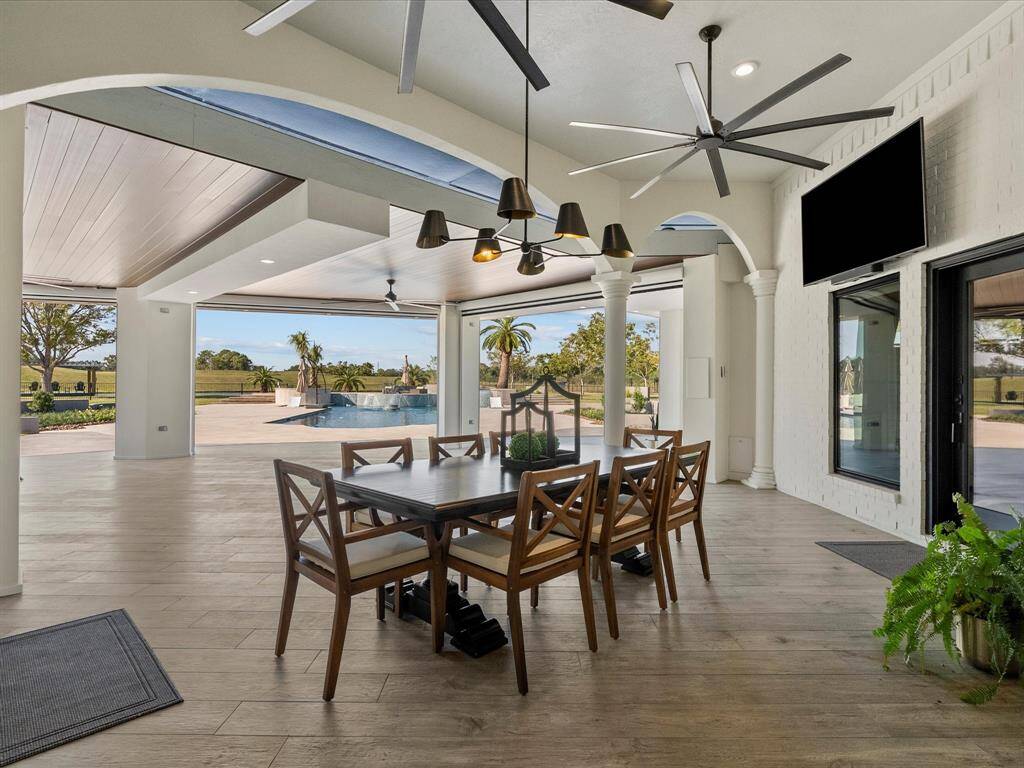 Charming patio oasis with integrated ceiling fans for ultimate comfort.