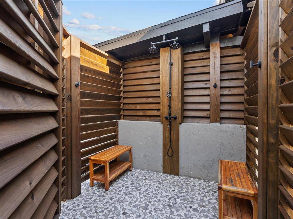 Convenient poolside outdoor shower, perfect for a refreshing rinse under the sun.