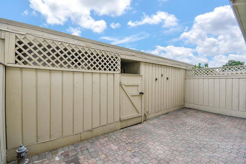 This gate leads to your covered carport and private garage.