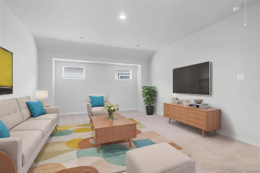 Come upstairs and enjoy a day of leisure in this fabulous game room! This is the perfect hangout spot or adult game room, this space features plush carpet, high ceiling, recessed lighting and custom paint.