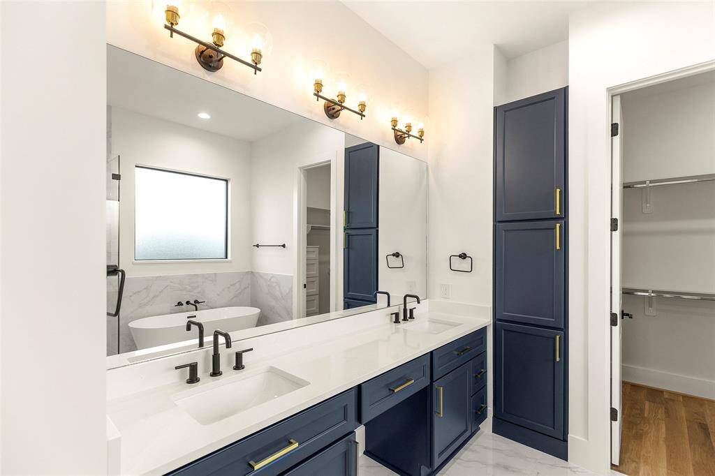 tasteful selections abound in this primary bath retreat, notice one of the 2 owners closets with custom designed built ins