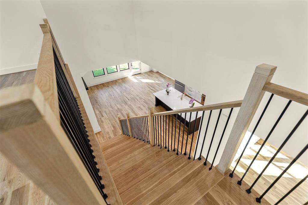 standing at the head of staircase (in the game room)looking into the greatroom below.