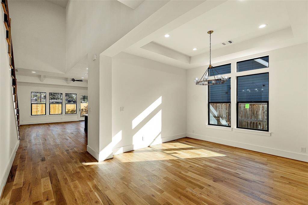 As you enter the front foyer, the private study as well as the full formal dining room are both light filled. Modern fixtures thruout the home as well as FULL White Oak Hardwoods