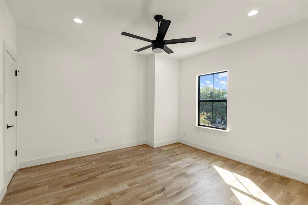 Secondary bedroom three, good light, white oak hardwood and ensuite bath