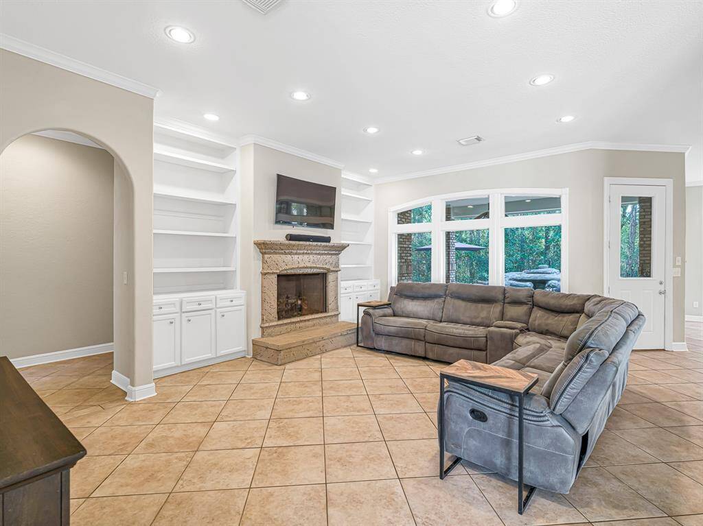 Large family room with recessed lighting and fireplace