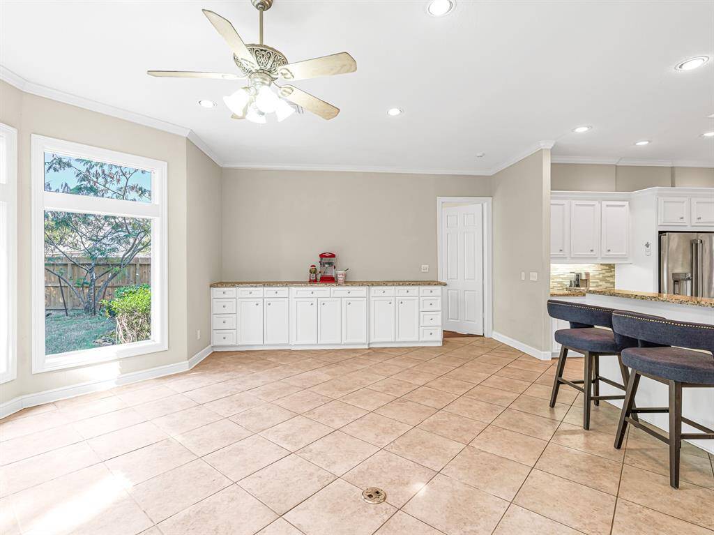Breakfast room with tile flooring and buffet counter