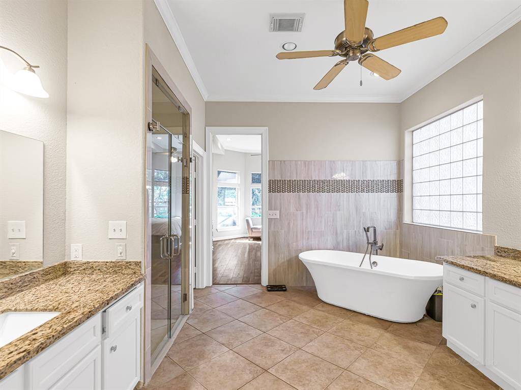 Ensuite bath with large soaking tub, walk-in shower and dual sink areas