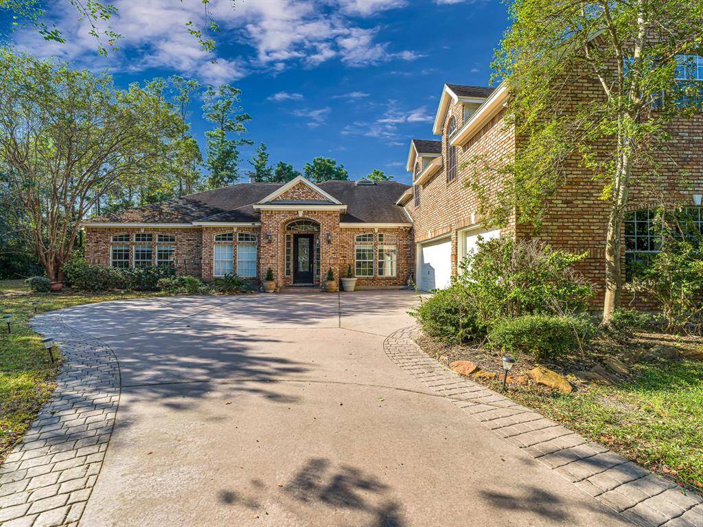 Three car attached garage and single to double wide driveway