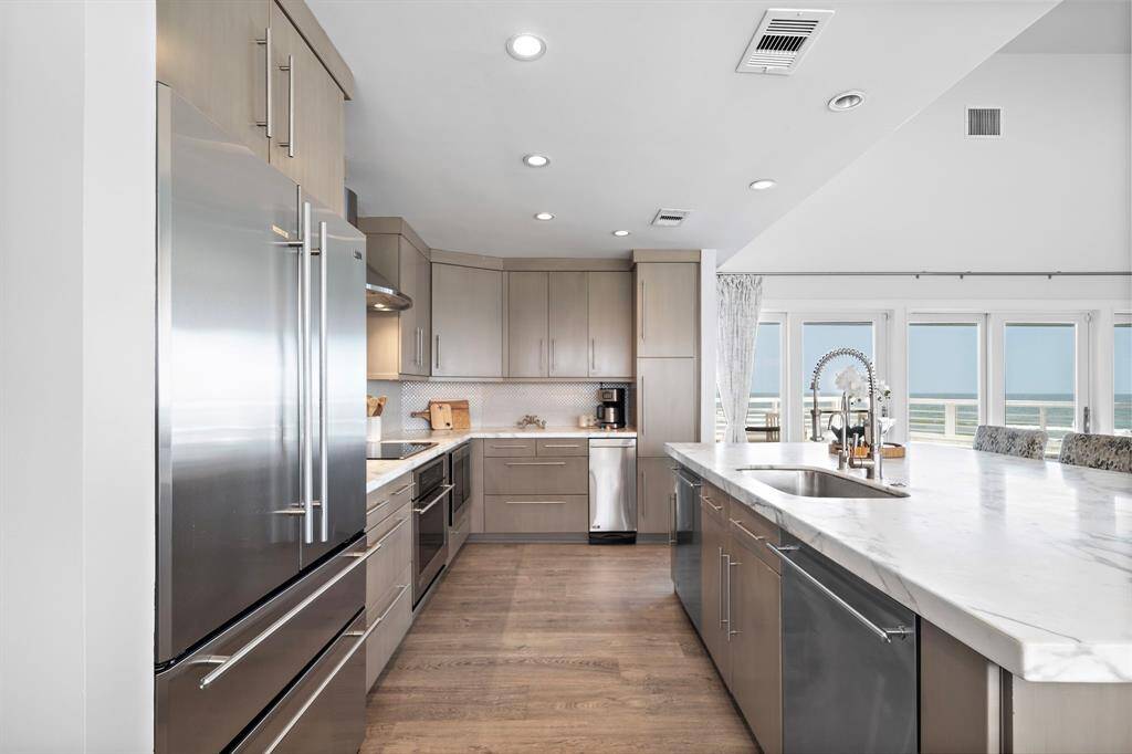 No expense was spared on the fine marble countertops, top of the line appliances, and soft close drawers.