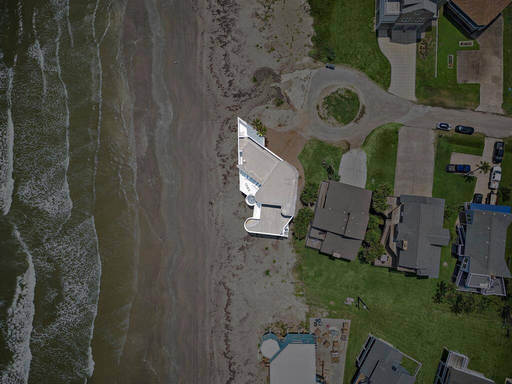 The aerial view of this home reveals the extraordinary lines on this one of a kind luxury waterfront home.
