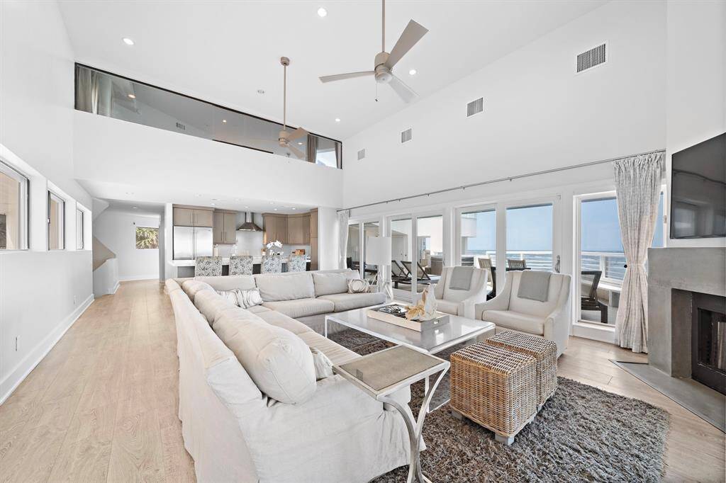 Loaded with light, and majestic high ceilings, this room is great for relaxing and entertaining.