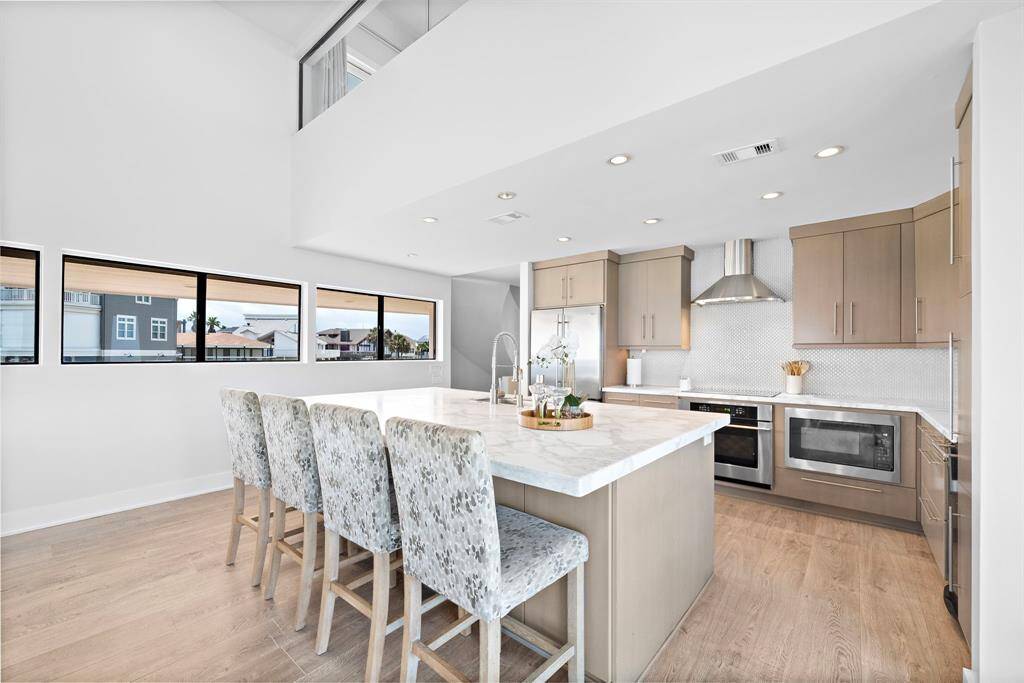 Kitchen bar seating allows for effortless entertaining.