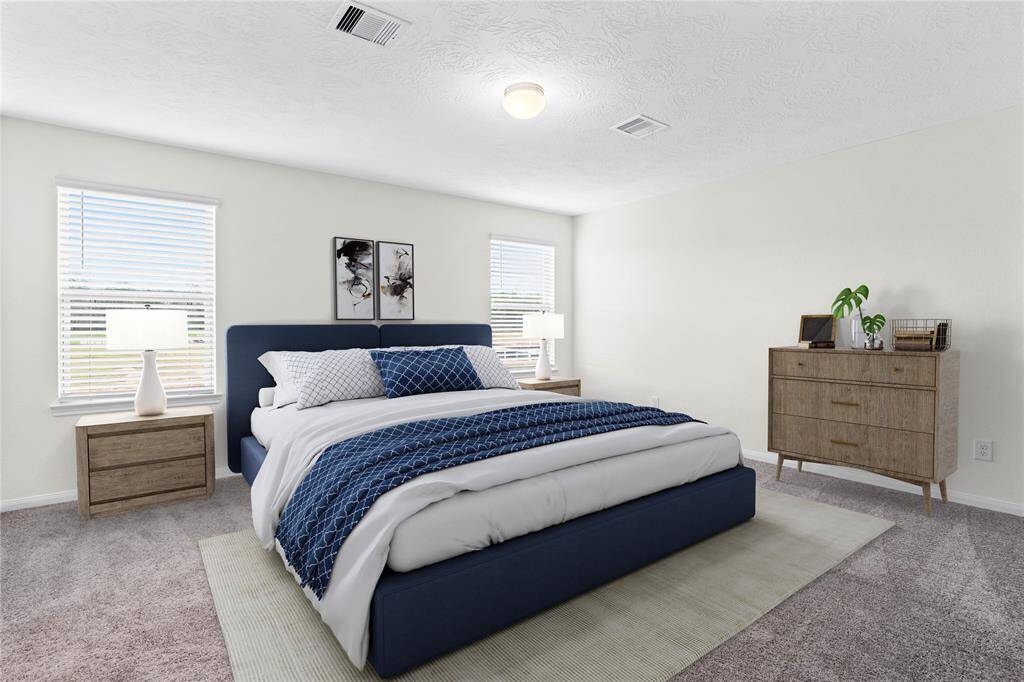 Come and unwind after a long day in this magnificent primary suite! This spacious room features plush carpet, warm paint, high ceilings, lighting, and large windows with privacy blinds.