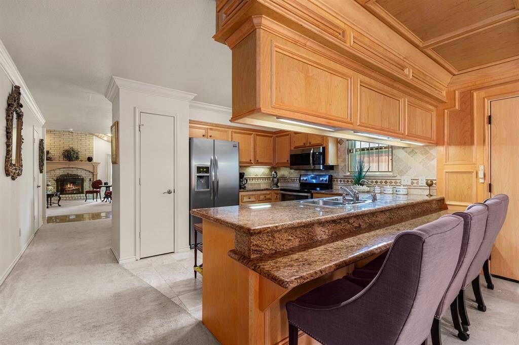 Efficient kitchen with granite counters and pantry