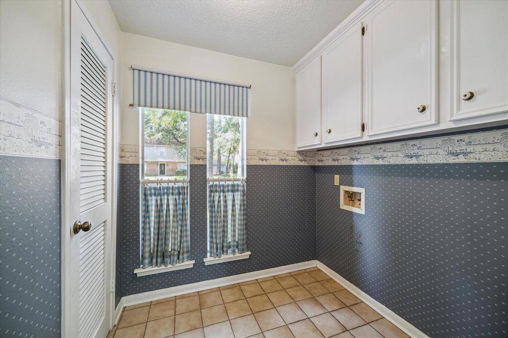 Maximize organization with additional storage in the utility room.