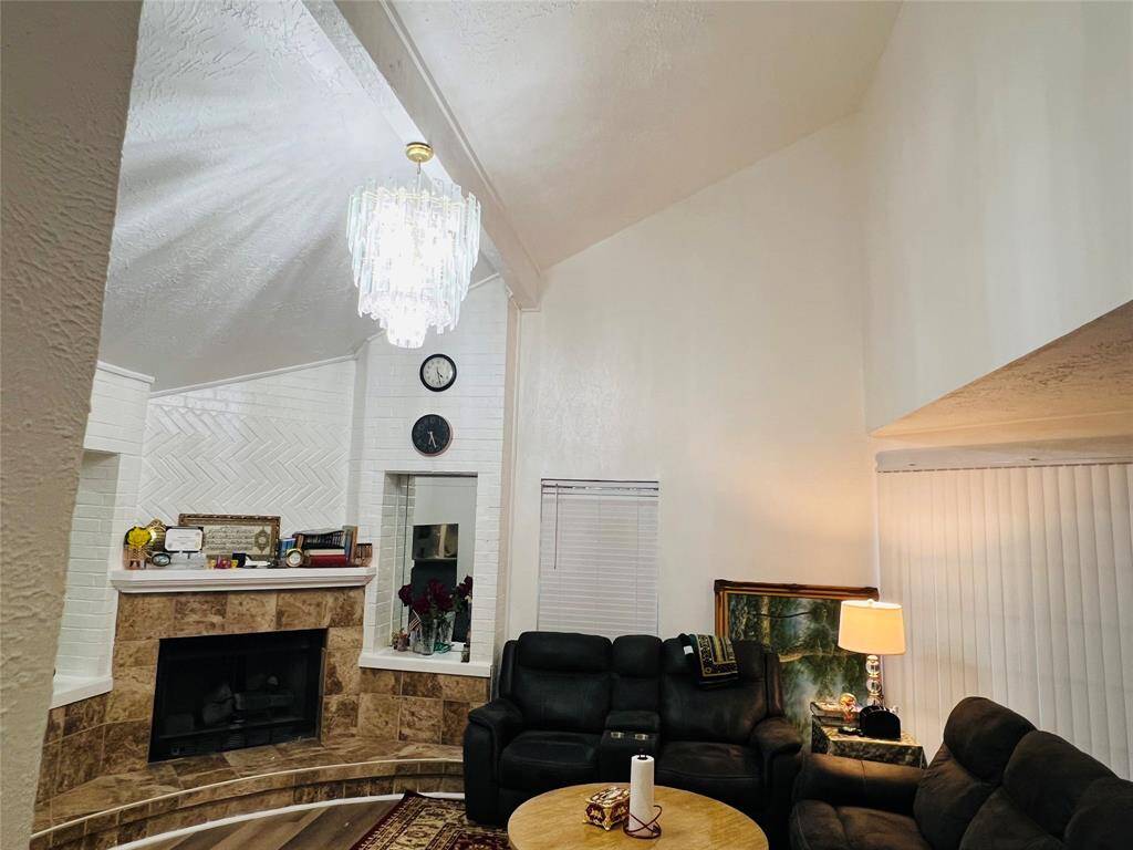 Living room other sidewith high ceiling