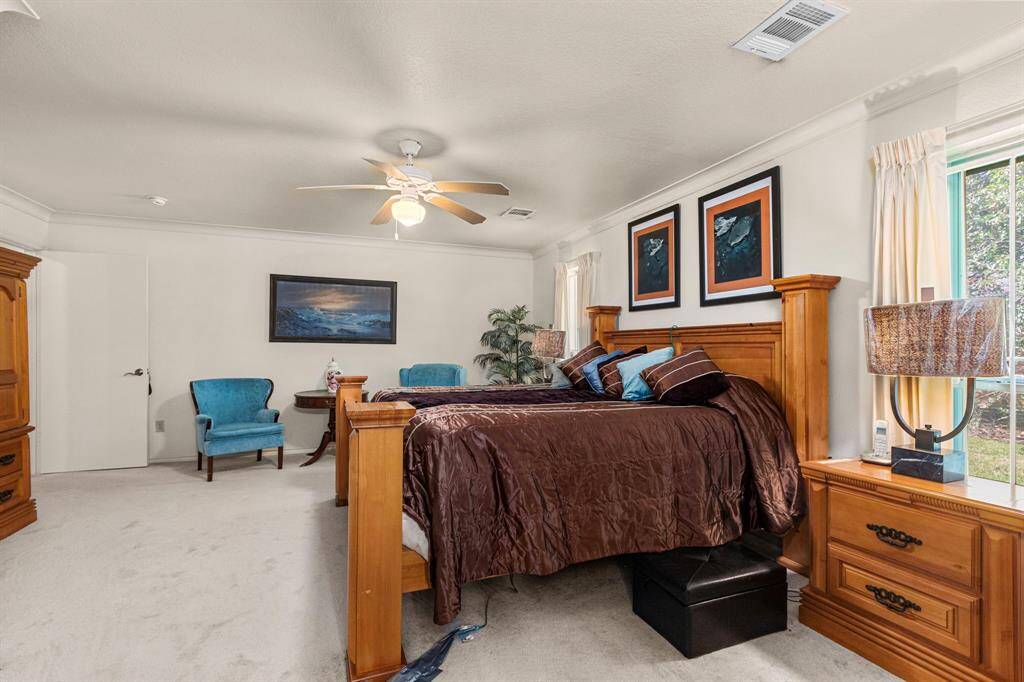 Alternate view of the primary bedroom. Note the crown molding