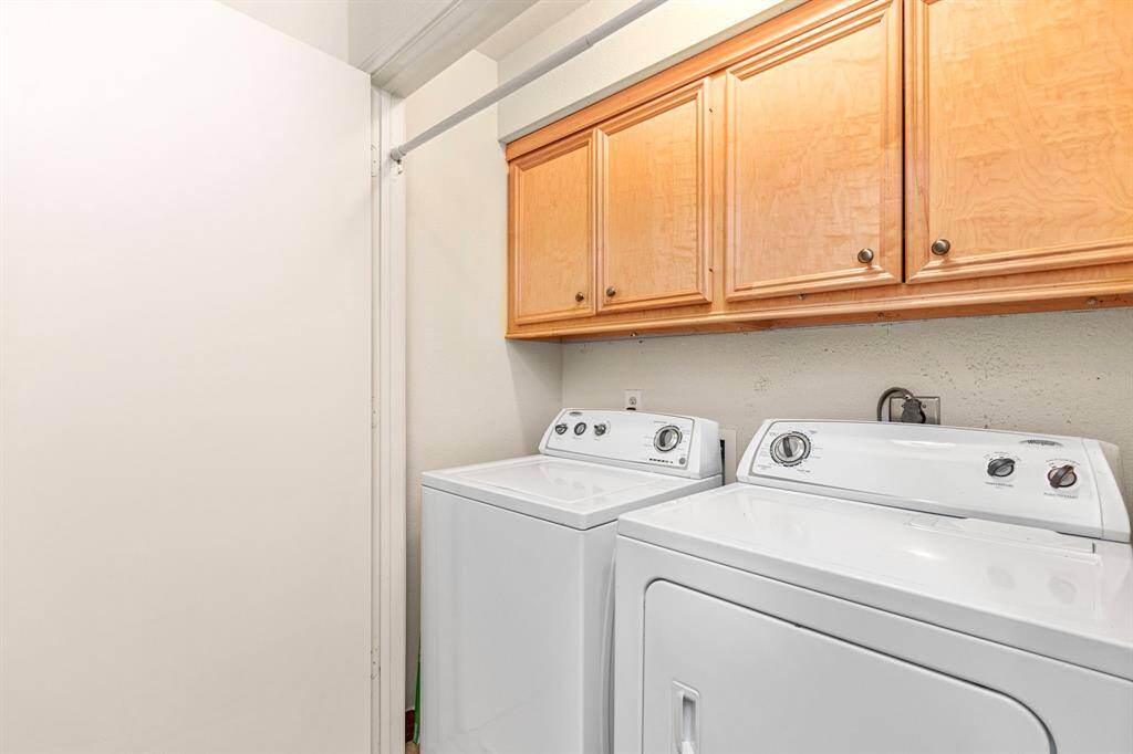 Utility room with additional storage.