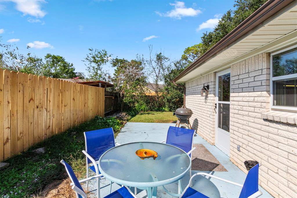 Side patio with access door to the family room