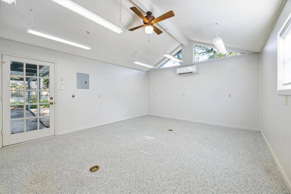 Bright, versatile room with outdoor access ideal for a workout room or workshop.