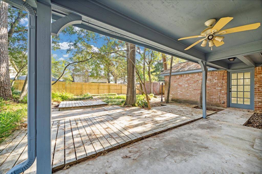 Inviting outdoor covered patio lighting and ceiling fans.