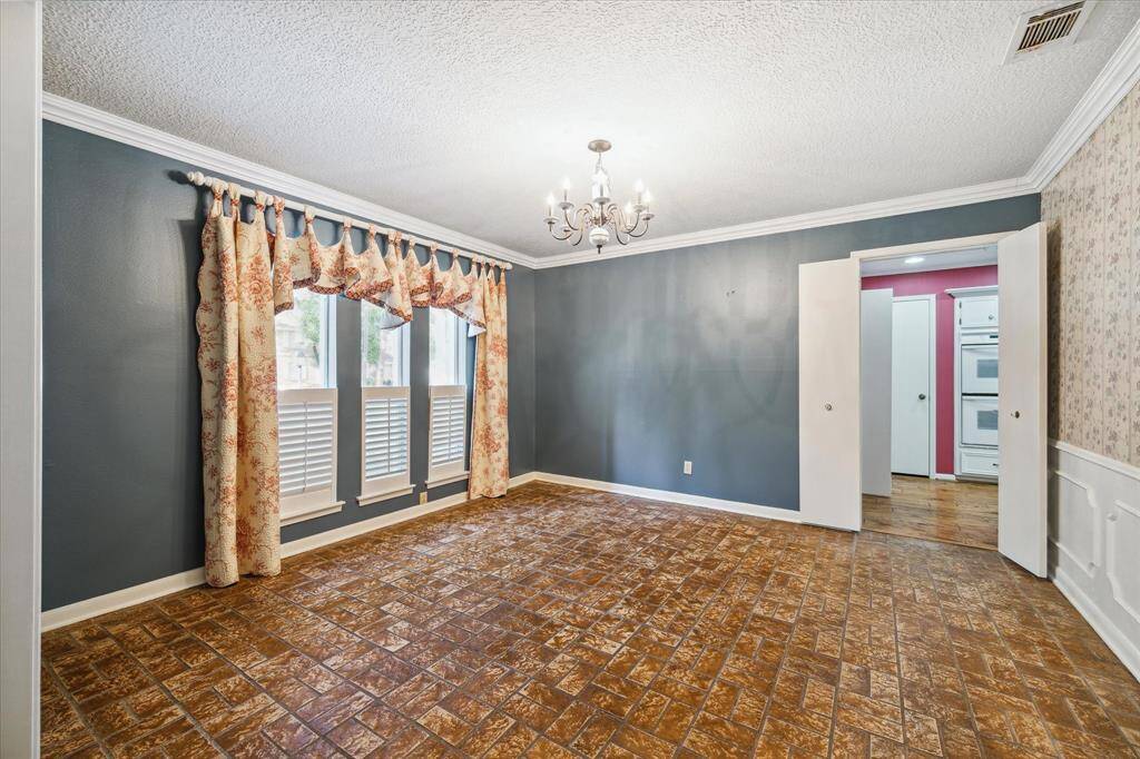 Inviting dining space adjacent to the foyer, easily connected to the kitchen.