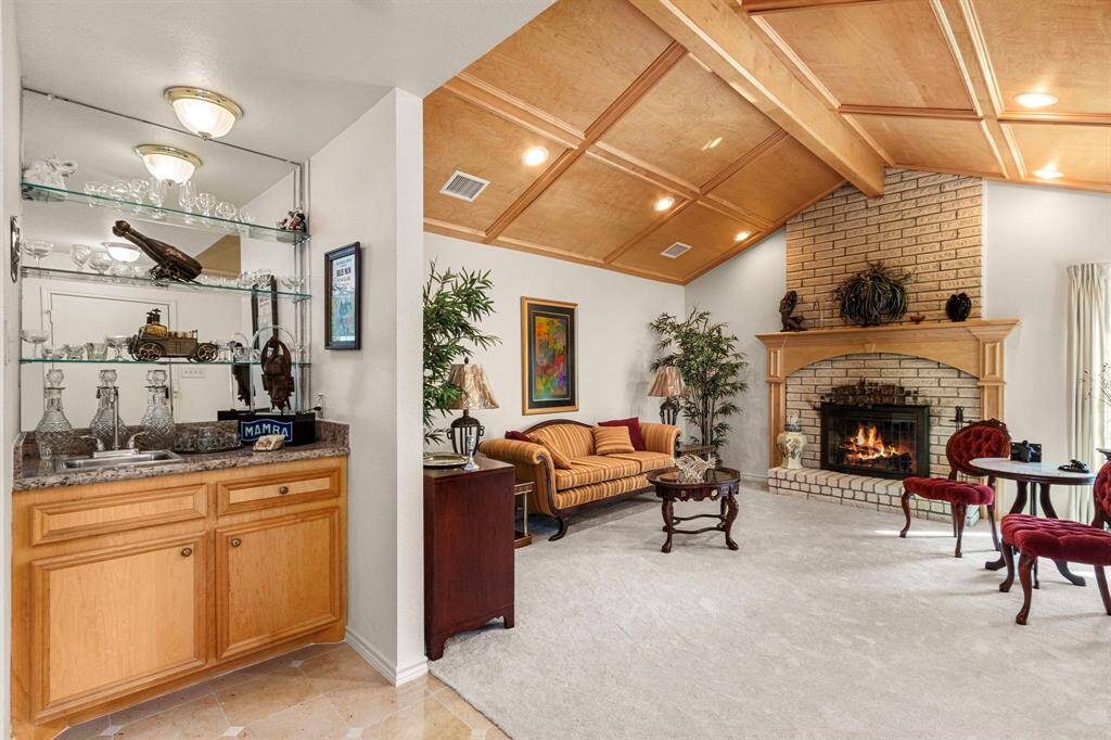 Wet bar with custom built-ins and granite counter
