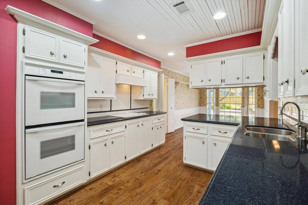 Create culinary delights in your kitchen, featuring double ovens and cooktop.