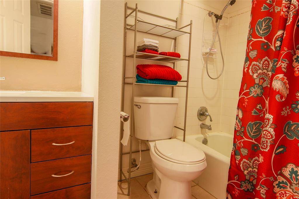 Secondary bath with tub/shower combo.