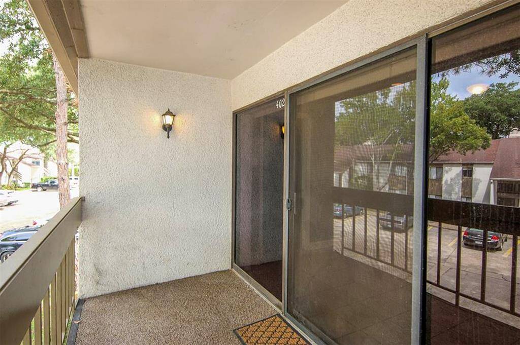 Covered balcony just off the family room.