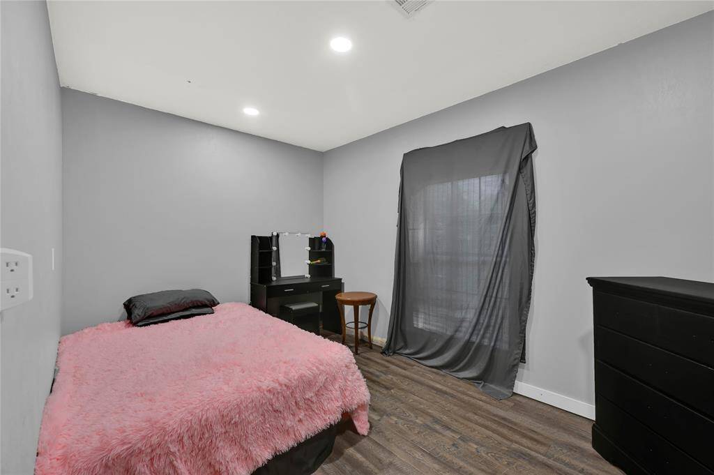 Additional room currently being used as as bedroom, located off of kitchen (garage buildout).