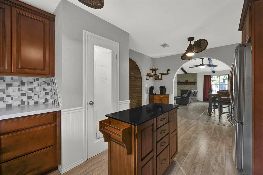 Kitchen leading into the spacious dining area.