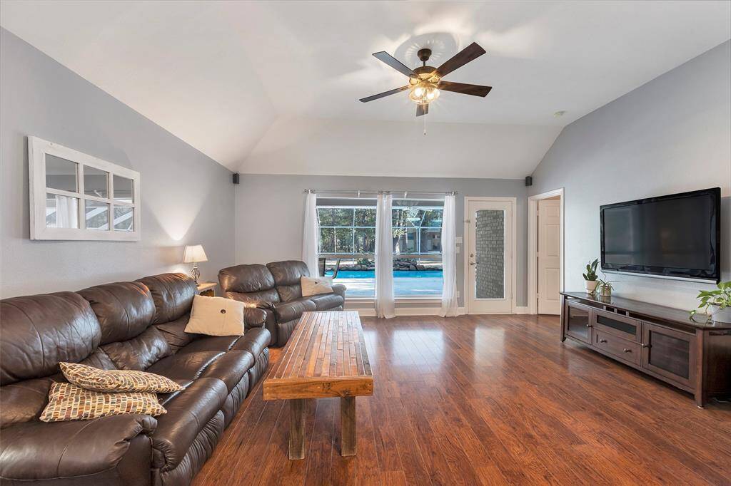 Living room with screened in pool right off the back of home