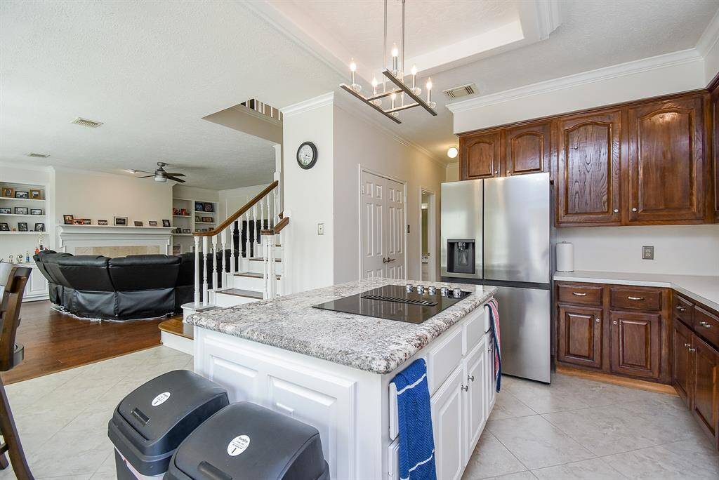 Inviting kitchen view into a cozy den, perfect for seamless entertaining.