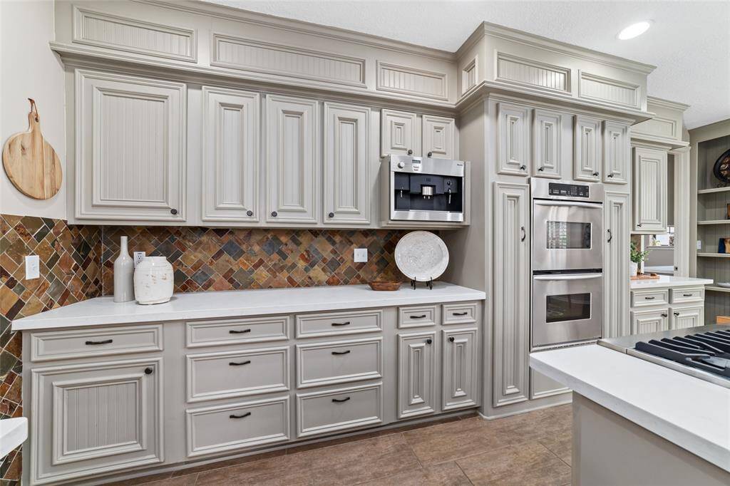 This amazing kitchen has storage galore, including pull-out cabinets on both sides of the double convection oven for all of your cooking essentials.