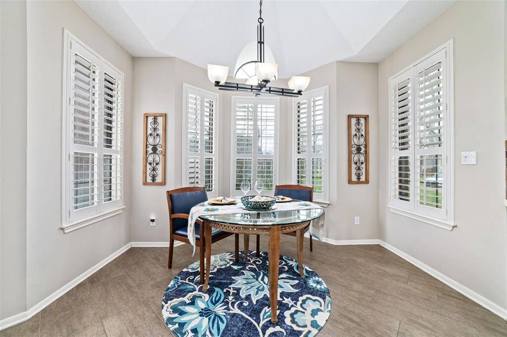 This charming breakfast area features beautiful bay windows that bring in tons of natural light. It's the perfect spot to start your day!