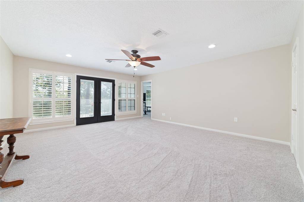 Recently updated jack and jill bathroom attached to the upstairs front bedroom features large vanity with quartz counters, updated lighting, wood look tile flooring and tons of cabinet and closet space.