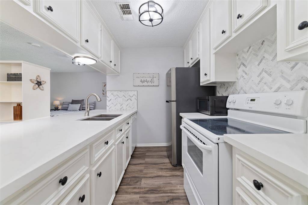 Detached 2 car garage with 2nd floor garage apartment and expansive driveway. Outdoor equipment and tools can be conveniently stored in this wooden storage shed.