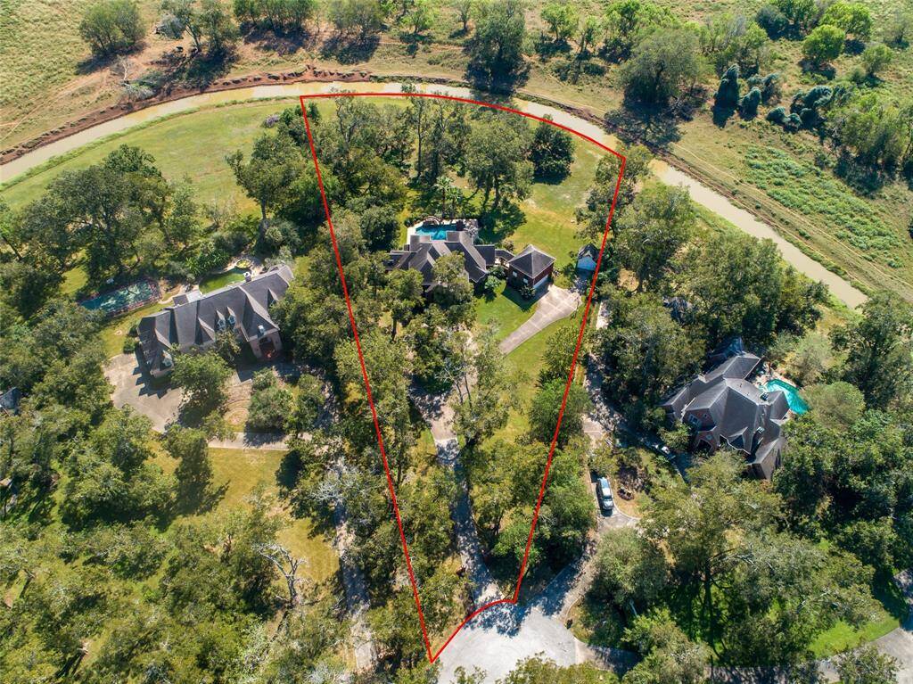 Here's another aerial view of this stunning property with red lines indicating the approximate boundary lines.