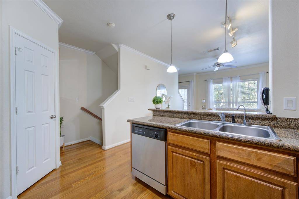 The living areas are in the 2nd and 3rd floor. This is a view to the stairs from the kitchen.