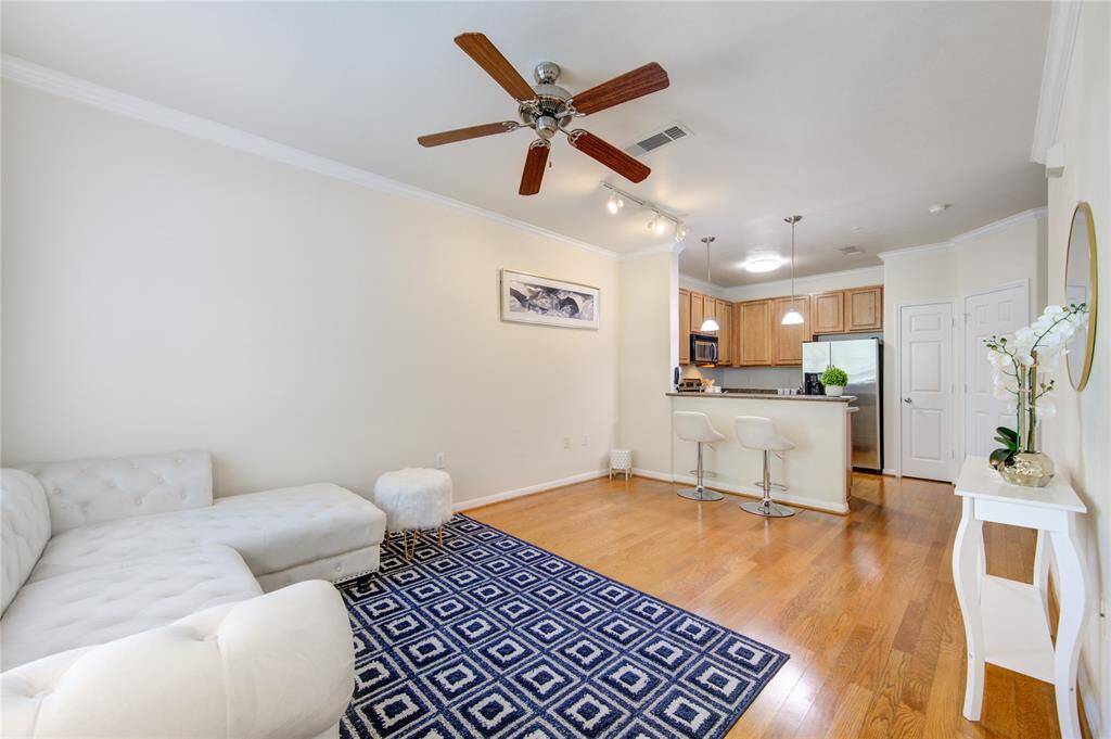 Main area offers space for a living room, a breakfast area and a kitchen overlooking the common areas.