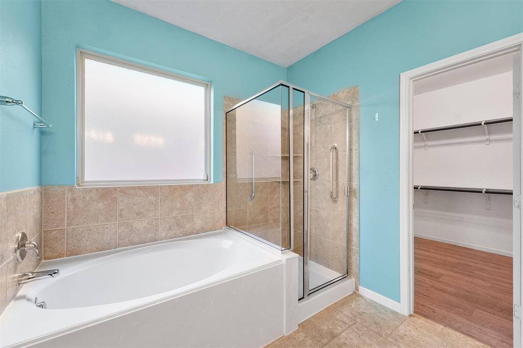 Primary bathroom with separate shower and tub